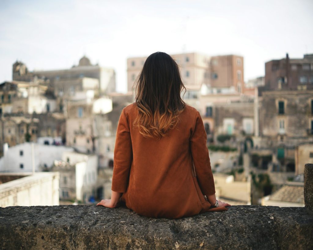 Know Inside Out: The Strongly Suggested Pegword System to Systematically Improve Recall 7 woman in brown long sleeve shirt sitting on gray rock during daytime