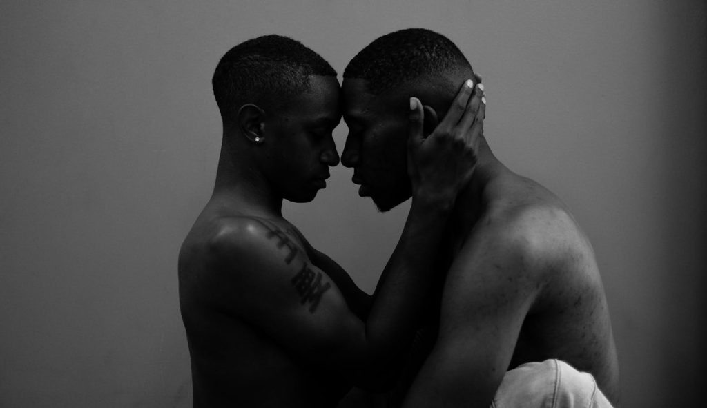 How to Get Rid of Early Pregnancies, Sexually Transmitted Diseases, Gender Neutrality? 8 Black and white photo of a couple embracing, showcasing intimacy and love.