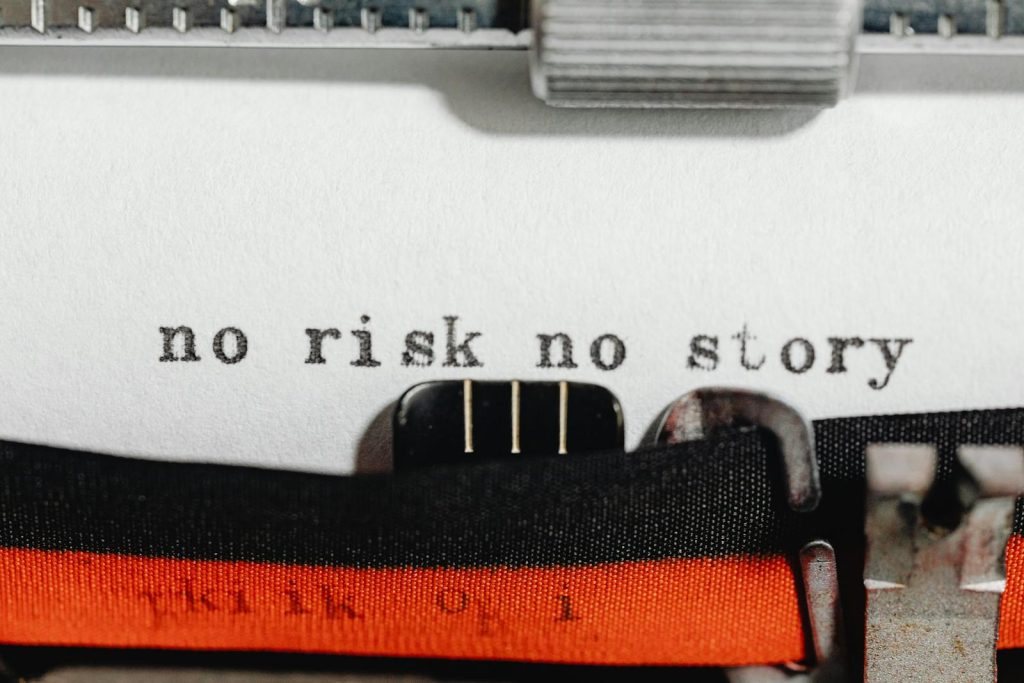 Solid Strategy to Sweeping Collaborative Desktop Publishing Team for Campus Journalism During Press Conference 5 Close-up of a vintage typewriter typing 'no risk no story' on paper.