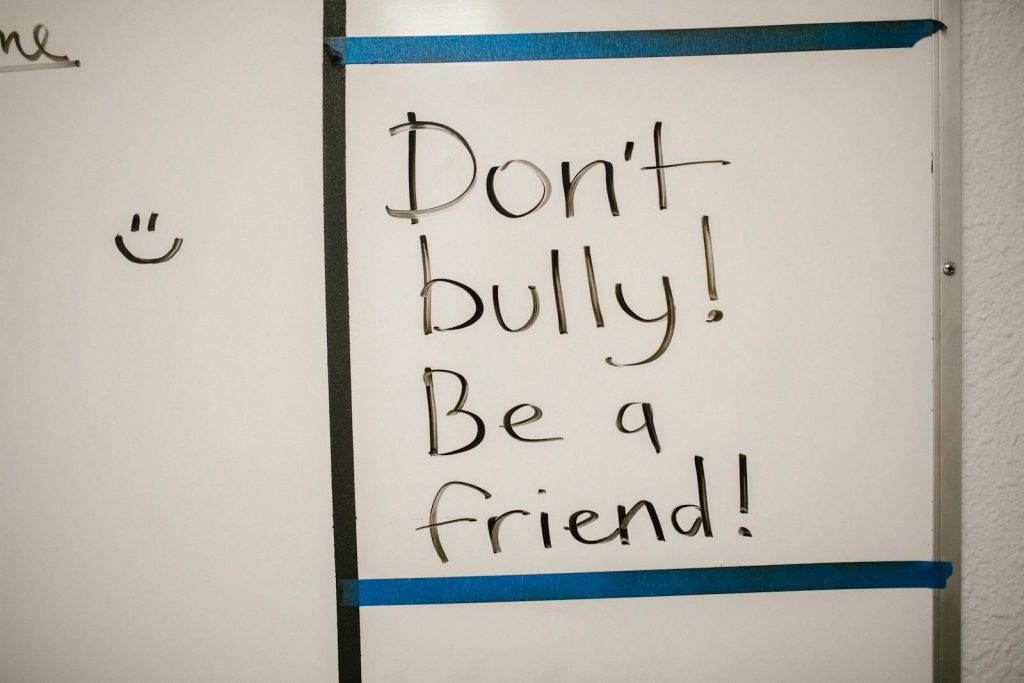 Get Rid of Boring Lessons, Try This 12 Classroom Management Tips for Lower School Learners in the Digital Age 7 Message against bullying written on a whiteboard, promoting friendship.