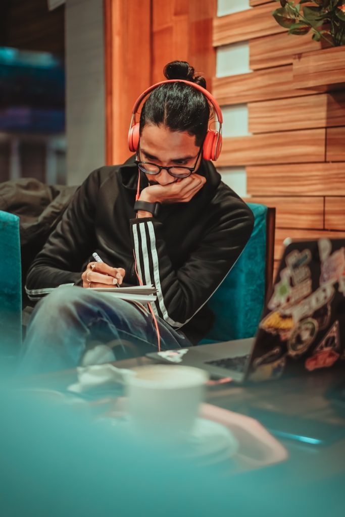 Music Can Boost Your Study Sessions, Here are 5 Tunes Legitimately Used by Pro Students 7 man in black jacket sitting on chair