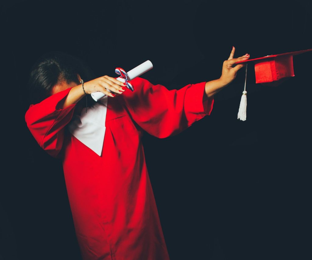 6 Completely Jaw-dropping Benefits of Parental Involvement in Child's Academic Success 9 person wearing red graduation dress