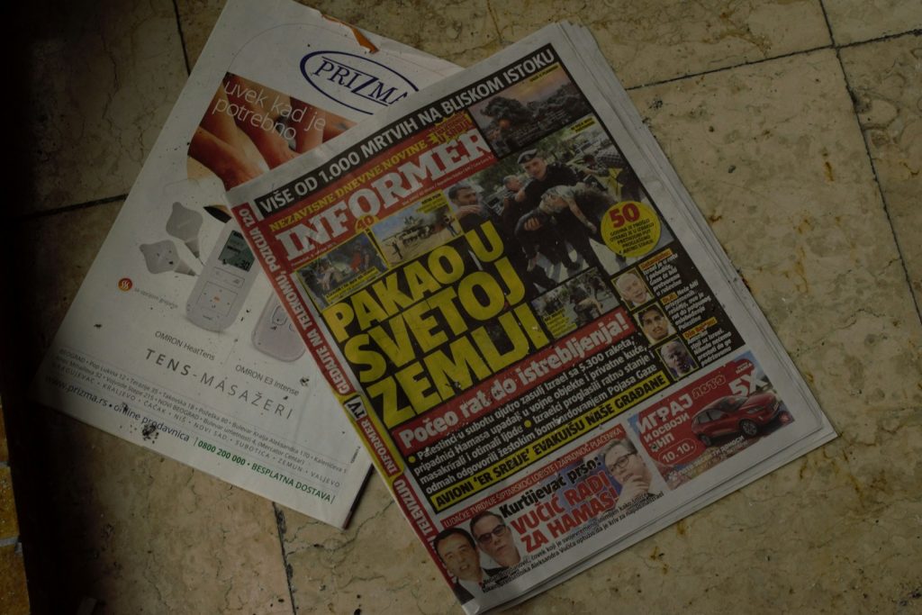 Craft Superior Stories: 12 Point Checklist to Write Straight News Article for a Tabloid 6 a pile of newspapers sitting on top of a tiled floor