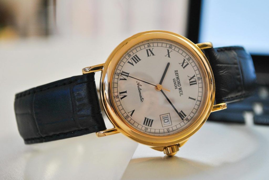 5 Minute Rule Immediately Puts Procrastination Away - Highly Recommended for Busy Students 5 Close-up of a classic gold wristwatch with a black leather strap, showcasing time precision and elegance.