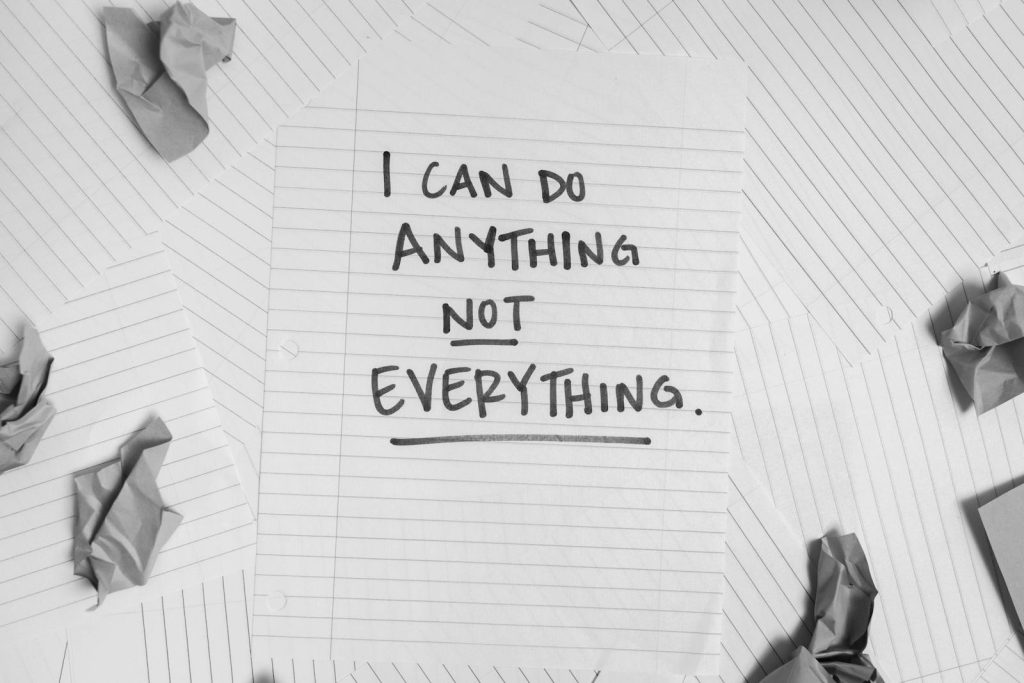 Dear Students, You Can Master Time Management by Following These 7 Steps 5 A motivational message on paper surrounded by crumpled sheets, symbolizing focus amidst chaos.