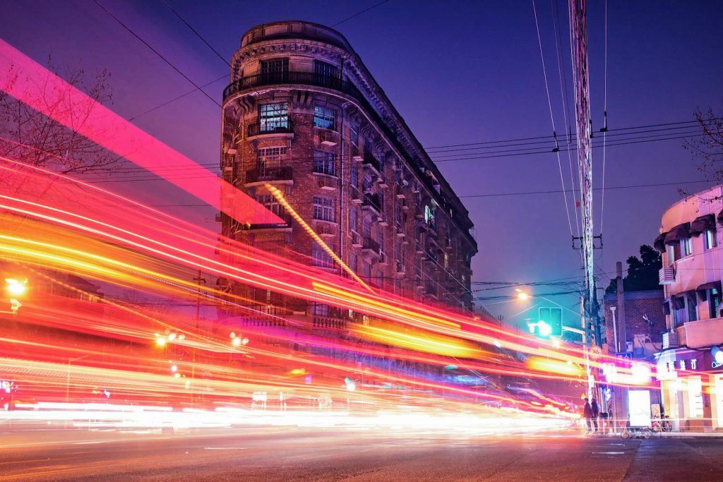 Should You Be Practicing Speed Reading Technique? Student with High IQ Does 6 A dynamic long exposure of traffic light streaks against historic Shanghai architecture at night.