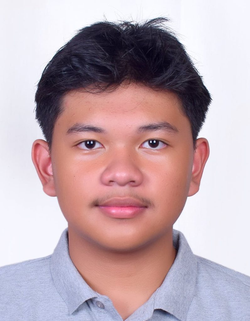 If You Are Complaining About School Haircut Policies, Think Again. Real World Job Regulations Are Harshier 6 Close-up portrait of a teenage boy wearing a grey polo shirt, facing the camera.