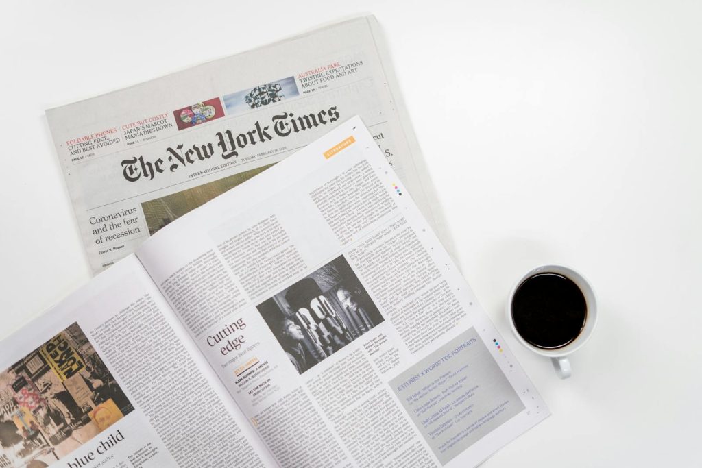 10 Tips Turn Yourself into a Sterling News Writer at Press Conferences 9 Flat lay of a coffee cup and The New York Times newspaper, ideal for business and lifestyle themes.