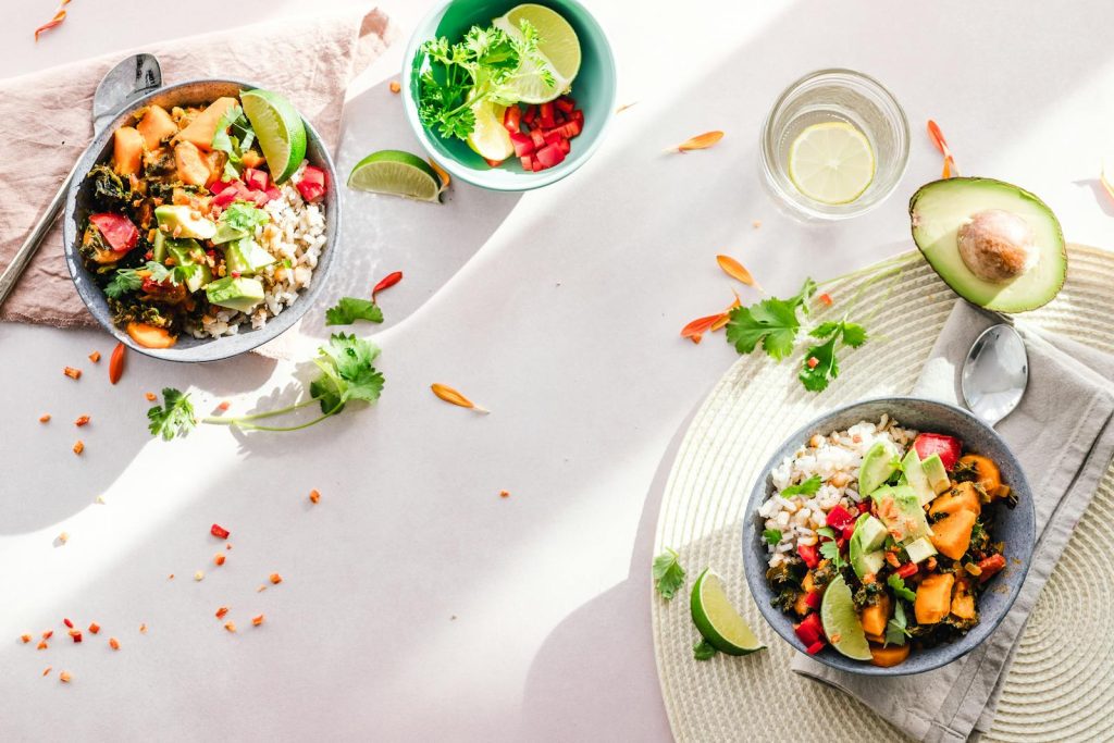 Ultimate Checklist on the Four Pillars of Overall Health - Oplan Kalusugan sa DepEd 6 Top-down view of vibrant vegan bowls filled with fresh vegetables, perfect for a healthy meal.