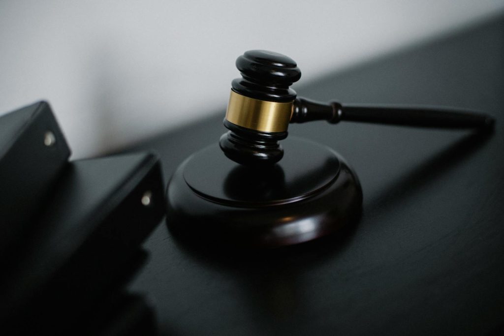 This is the Great Story of 3 Siblings Who Passed the Bar Exams Together, Tatlo Lahat Abogado 5 Close-up of a wooden gavel on a desk, symbolizing justice and legal authority.